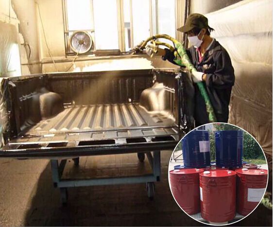 Operator spray-applying polyurea bed liner inside a pickup truck bed